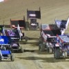race cars come out of a turn